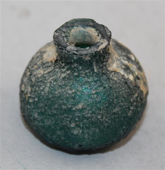 Two Roman green glass vessels, c.2nd century AD, 12cm